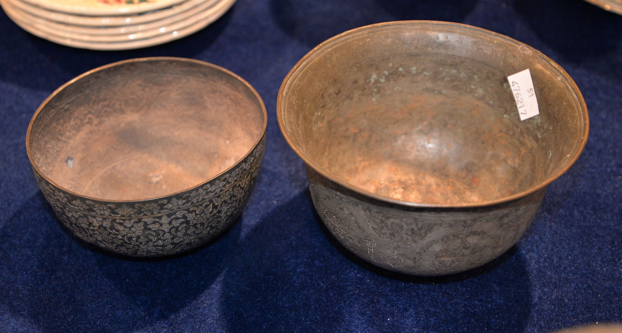 Two 19th century Indian bowls, one inlaid in gilt metal with an all over flower design