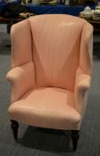 A late Victorian pink and white upholstered wing armchair