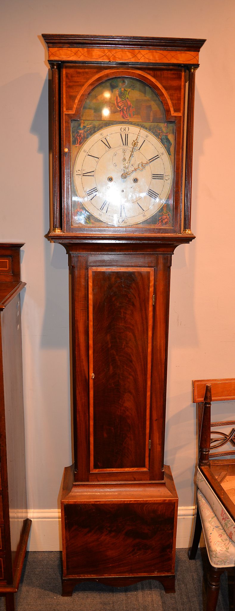 A mahogany and inlaid longcase clock, the 13 1/2inch painted and arched dial with Britannia within