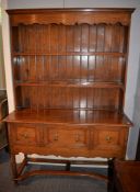 An oak dresser in George II style, 20th century, with plate rack superstructure above base with