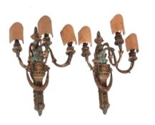 A pair of Continental painted and gilt composition three light wall appliques, late 19th / early