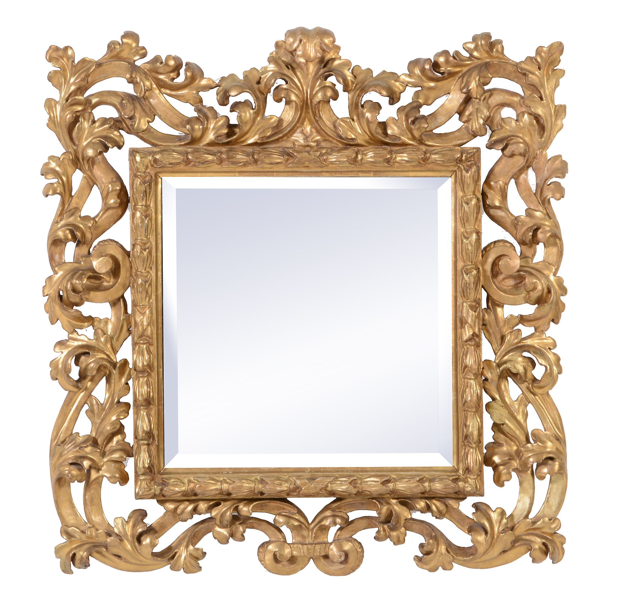 A Continental carved giltwood wall mirror in Italianate taste, the later bevelled mirror plate