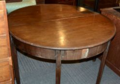 A pair of George III mahogany D-shaped side tables, formerly from a dining table
