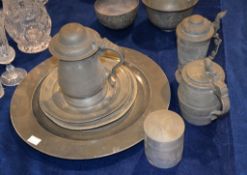 A quantity of pewter including tankards and plates
