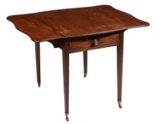 A George III mahogany Pembroke table, circa 1790, the 'butterfly' shaped moulded top above an end