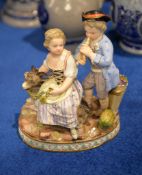 A Meissen group of two children with a goat, late 19th century, modelled wearing 18th century dress