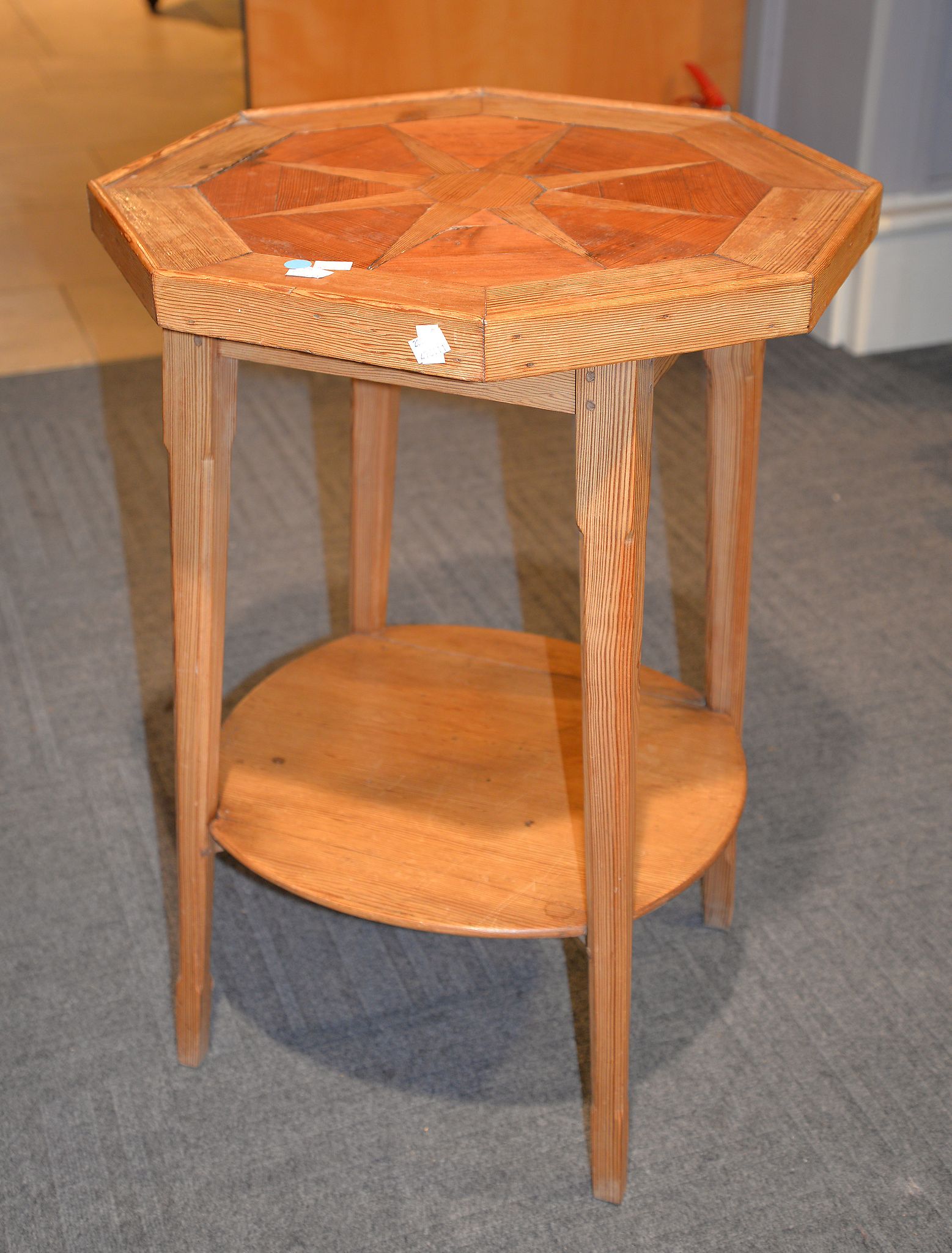 A late 19th century pitch pine occasional table, with starburst motif, 80cm high, 58cm wide