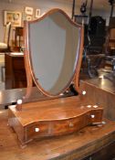 A George III mahogany platform dressing table mirror, with shield shaped mirror above three frieze