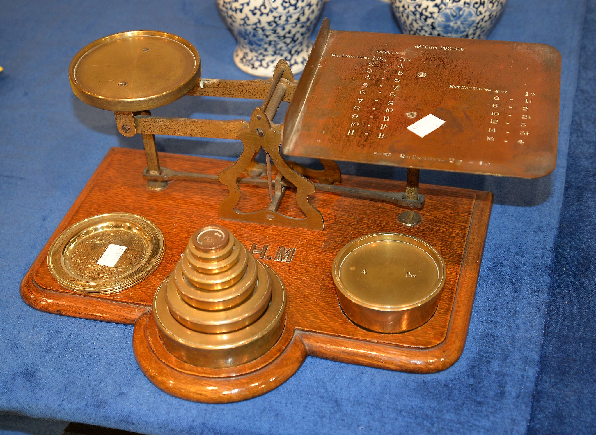 A set of Postal scales and weights, with initials, S. H. M, 38cm long Provenance: Hall Place, sold