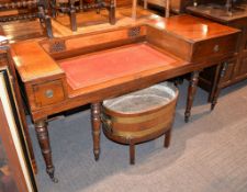A mahogany and inlaid desk, circa 1820 and later, formerly a square piano, with remains of a poker