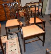 A set of six mahogany dining chairs in George III style, including two armchairs, together with