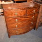 A George III mahogany bowfront chest of drawers, with two short and three long drawers each with