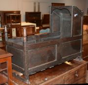 An oak child's crib, early 18th century, 80cm high, 45cm wide, 96cm long