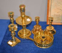 A 17th century Heemskerk type brass candlestick with pierced nozzle central drip pan, knopped stem
