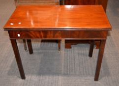 A George III mahogany tea table, the rectangular moulded top on square chamfered legs, 73cm high,