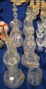 Twelve various glass decanters and stoppers