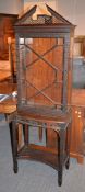 An Edwardian mahogany cabinet in George III style, with blind and pierced fretwork, 185cm high, 62cm