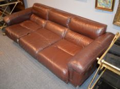 A leather upholstered three seat settee and a pair of matching armchairs, modern
