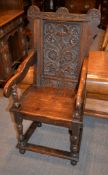 An oak armchair in late 17th century style, with ivorine label for W F Greenwood & Sons LTD, York to