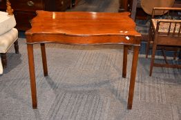 A mahogany serpentine-sided occasional table in George III style, late 19th century, 69cm high