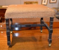 A mahogany upholstered dressing stool, cluster column supports and with brass label for W.