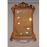 A George III walnut and parcel-gilt fret-frame wall-mirror, 61cm x 37cm