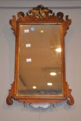 A George III walnut and parcel-gilt fret-frame wall-mirror, 61cm x 37cm