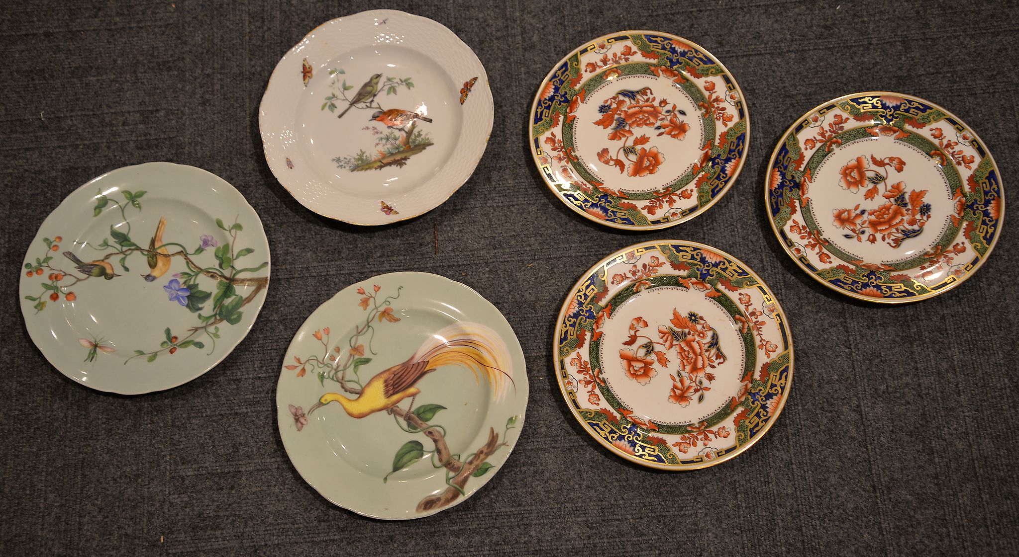 A 19th century Berlin plate, painted with birds in a tree, painted sceptre mark, and other