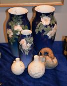 A pair of Royal Copenhagen blue ground slender ovoid vases, each 32cm high, another similar
