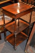 Ω An early Victorian rosewood whatnot, with three tiers the top tier with blind frieze drawer, 90cm