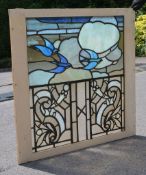 Five Arts and Crafts painted glass window panels, one 62.5cm x 82cm, in the original window frame;