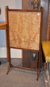 An Edwardian stained oak fire screen, 105cm high, 52cm wide