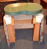 A white-painted kidney shaped dressing table, with integral triptych mirror, 133cm high overall;