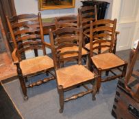 A set of eight elm and ladder back dining chairs each with rush seat, 20th century