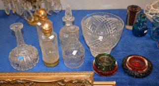 A pair of etched glass and gilt metal mounted decanters, three glass decanters (two lacking