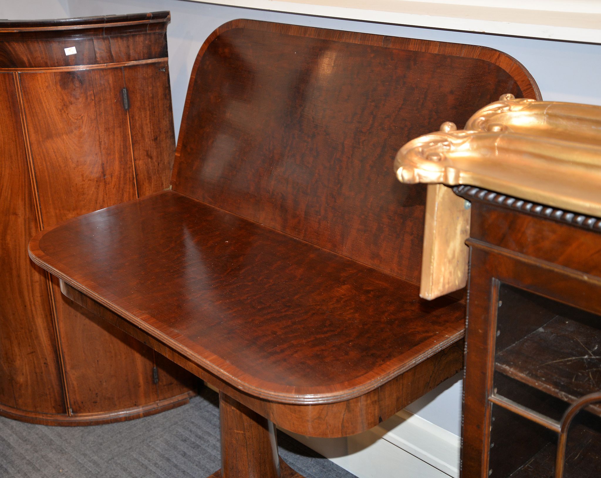 Ω A rosewood and mahogany tea table, the plum pudding mahogany top with partridgewood banding above - Image 2 of 2