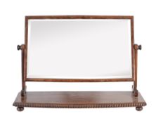 A George IV mahogany dressing mirror, circa 1825, in the manner of Gillows. 152cm high, 75cm wide,