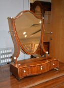 A George III mahogany shield shaped dressing table mirror, with ivory fittings, 58cm high Please