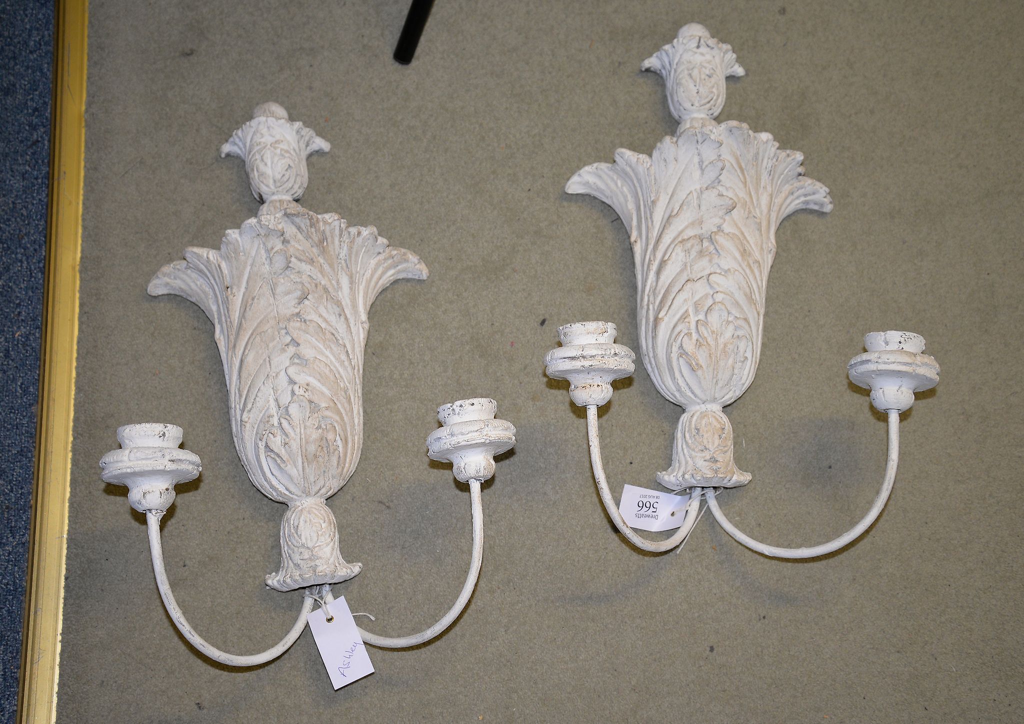 A pair of painted resin acanthus pattern wall lights