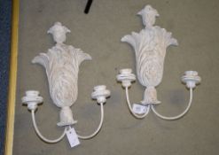 A pair of painted resin acanthus pattern wall lights