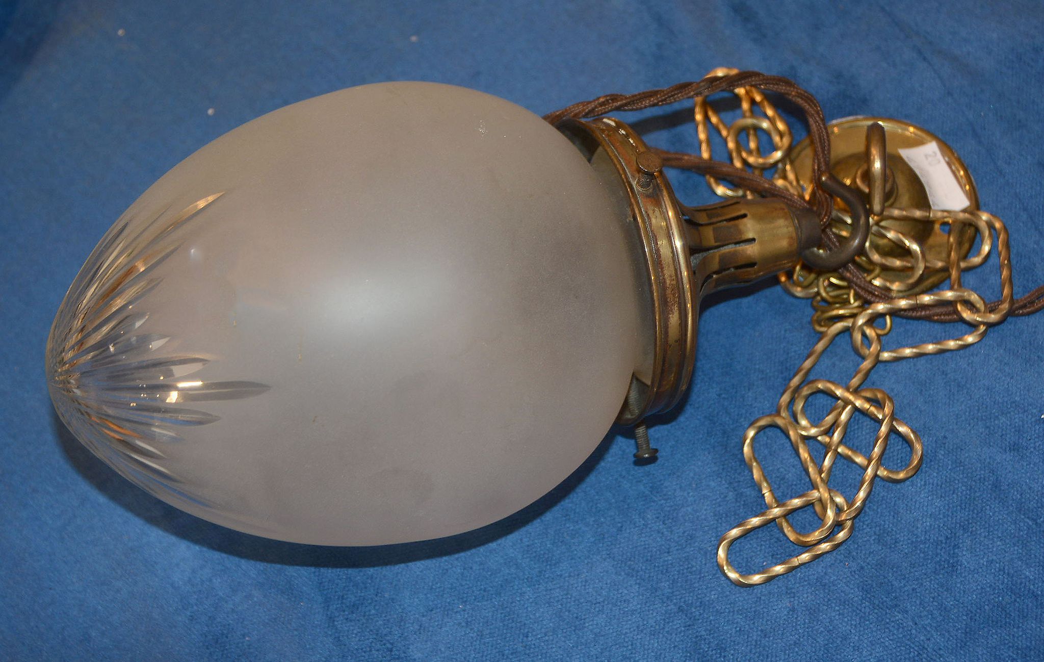 A frosted glass and gilt metal hall light, fitted for electricity, with ceiling rose and some