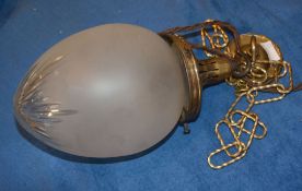 A frosted glass and gilt metal hall light, fitted for electricity, with ceiling rose and some