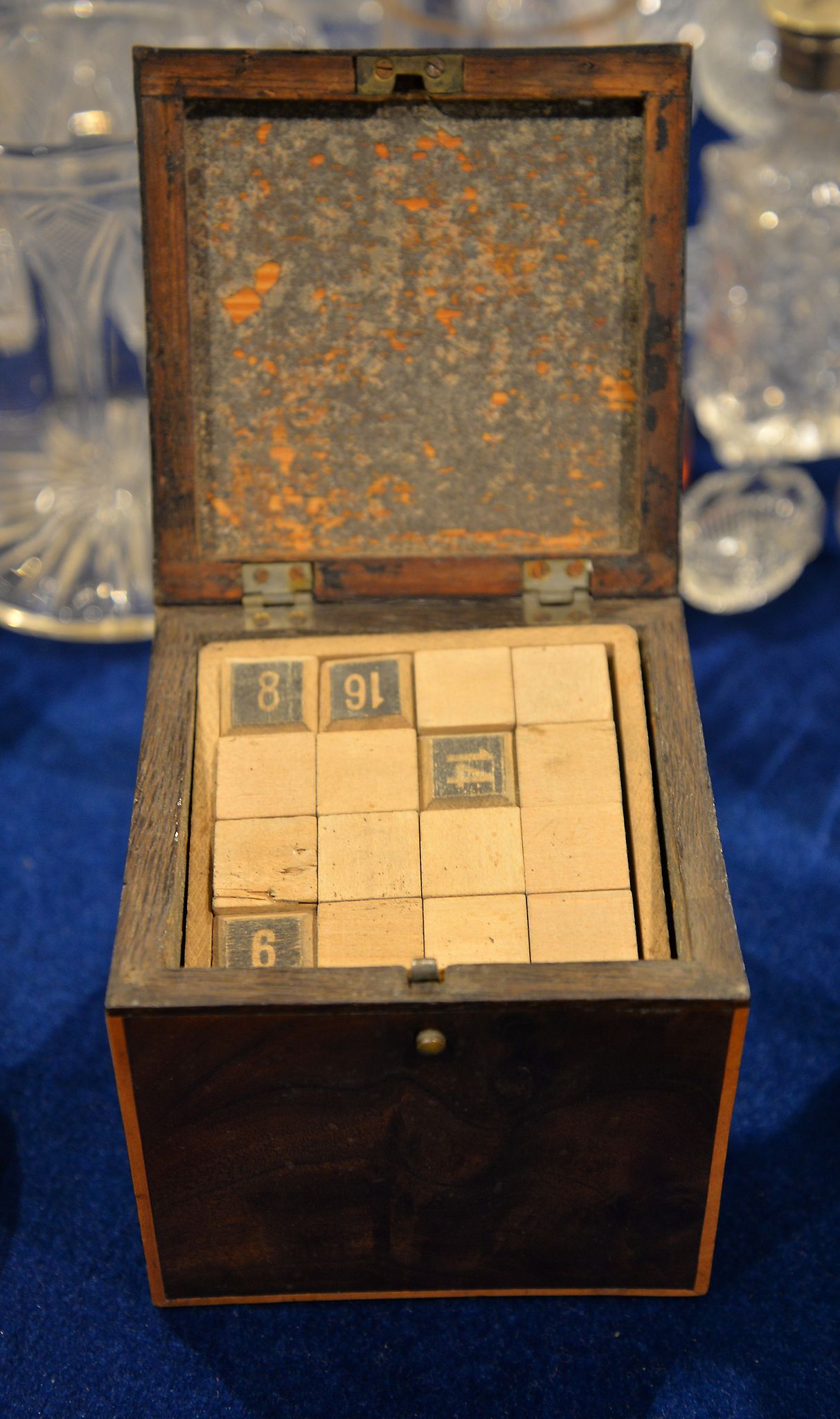 A George III mahogany tea caddy, of square form, containing a quantity of letters, 11cm high