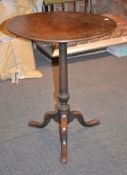 A George III mahogany pedestal tripod occasional table, 69cm high, 57cm diameter