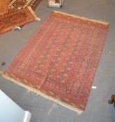 A Bokhara rug, approximately 210 x 158cm, together with a woven rug of Caucasian design,