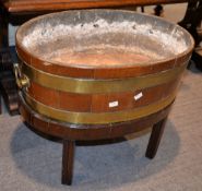 A George III mahogany wine cooler, now as a jardiniere stand, on an associated later stand, 62cm