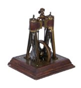 An unusual early 20th century model of a vertical twin cylinder live steam stationary engine, the