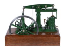A well engineered model of a live steam M E Beam engine, the beam supported on a turned central