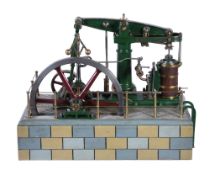 A well engineered model of a live steam M E Beam engine, the beam supported on a turned bright-work