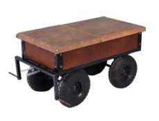 A four wheeled driving trailer, suitable for use with a traction engine and being of welded